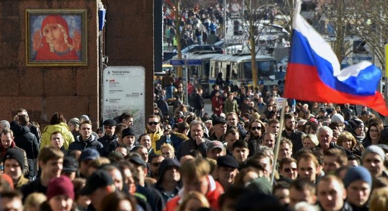 Protesters walk along Moscow's Tverskaya street during an unauthorised anti-corruption rally on March 26, 2017