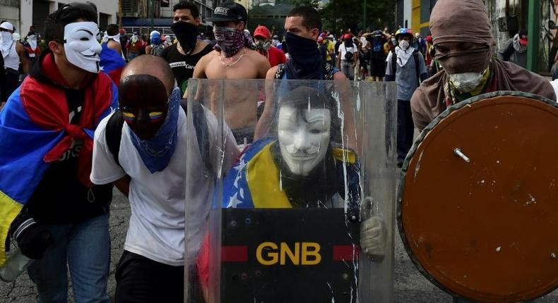 Anti-government protesters in Caracas on April 19, 2017, calling for President Maduro to go