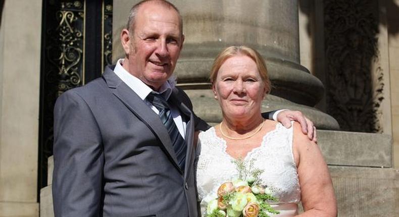 Christine and Taffy Sharlotte moments after being married, on the steps of Leeds Town Hall