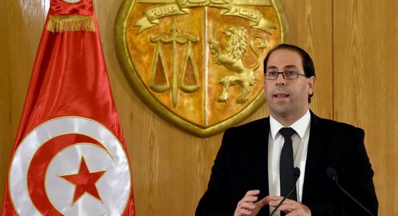 Tunisian Prime Minister Youssef Chahed, seen in August 2016, said the transition to democracy was costly for his country, which relies on France for help at this critical moment