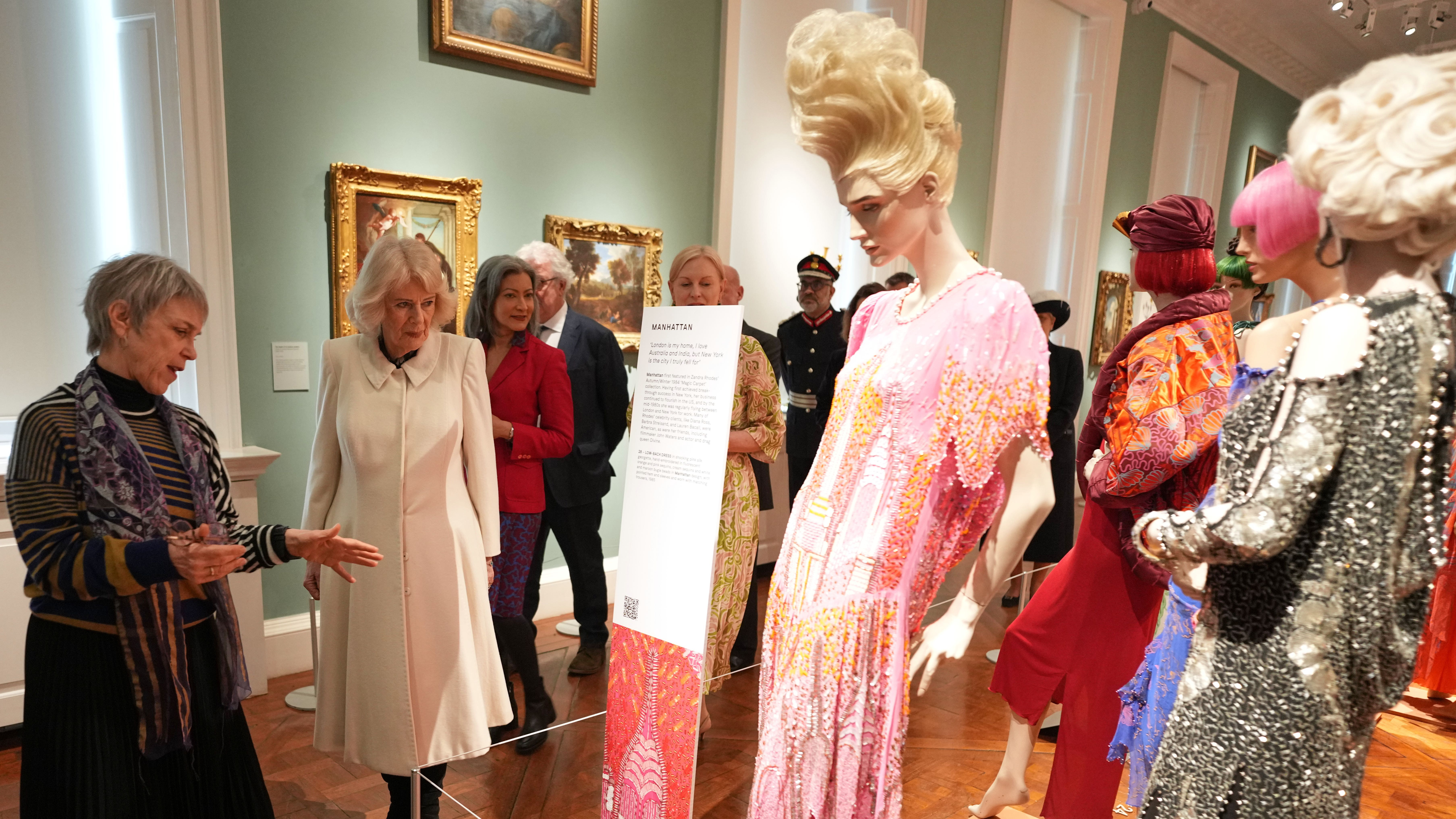 Queen Camilla reveals sister wore Zandra Rhodes wedding dress during Bath arts visit