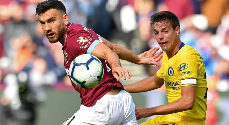 West Ham midfielder Robert Snodgrass (left) battles with Chelsea defender Cesar Azpilicueta during their Premier League clash at the London Stadium