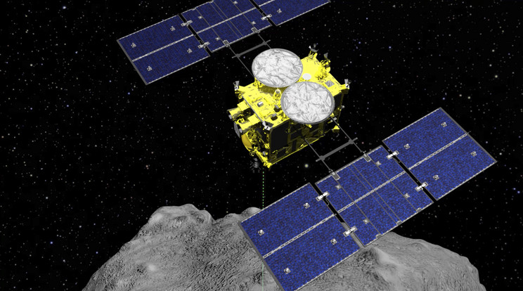 A Japán Űrkutatási Ügynökség (JAXA) által április 5-én közreadott számítógépes grafika a Hajabusza-2 (vándorsólyom) űrszondát ábrázolja a Ryugu kisbolygó felett /Fotó: MTI/AP