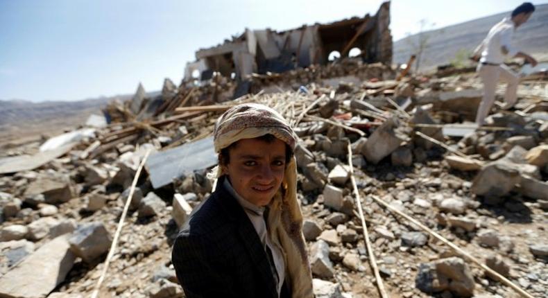 Yemenis check the site of an air raid that hit a funeral reception in the Arhab district, 40 kilometres (25 miles) north of the capital Sanaa, on February 16, 2017.