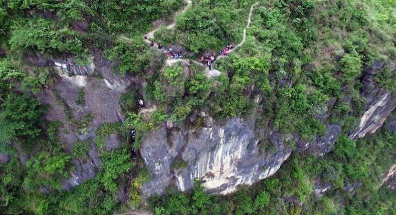 Pupils returning from school to their village, Atule'er, at the top of the mountain