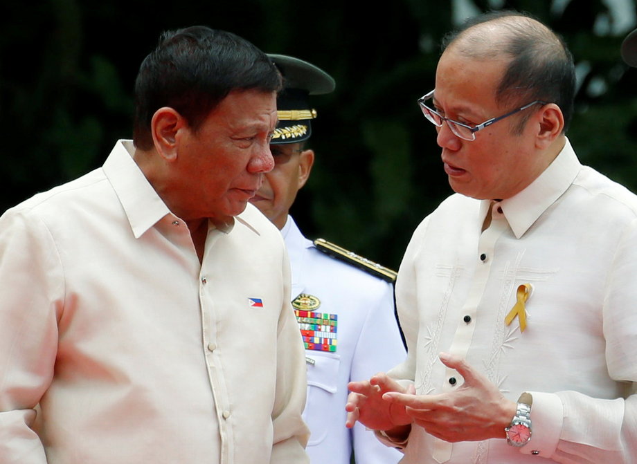 Incoming President Rodrigo Duterte, left, listens as outgoing President Benigno Aquino talks to him before Aquino leaves the Malacanang Palace in Manila, Philippines, June 30, 2016.