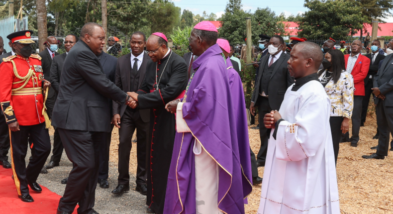 Archbishop Anthony Muheria receives President Uhuru Kenyatta and First Lady Margaret Kenyatta at the State Burial Service of former President Emilio Mwai Kibaki at the Othaya Approved School Grounds in Nyeri County on April 30, 2022. 