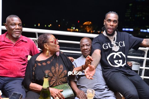 Burna Boy with his dad (far left) and grand parents at an event in 2018.