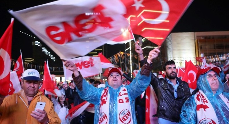 Supporters of Turkish President Recep Tayyip Erdogan celebrate as the 'Yes' camp claims victory in a referendum on changes to the constitution to give him greater powers