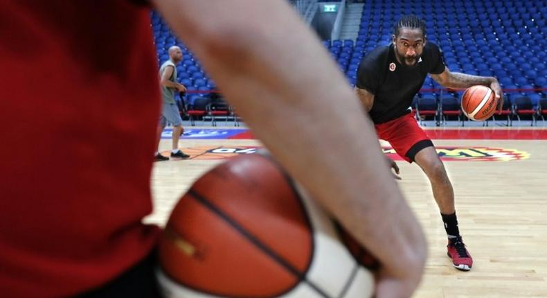 Former NBA All-Star Amar'e Stoudemire practises some dribbling during a basketball training session with his new club Hapoel Jerusalem on October 7, 2016