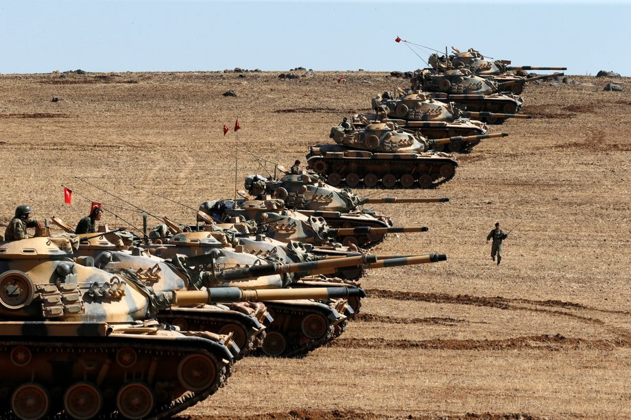 Turkish army tanks take up position on the Turkish-Syrian border near the southeastern town of Suruc in Sanliurfa province, October 6, 2014.