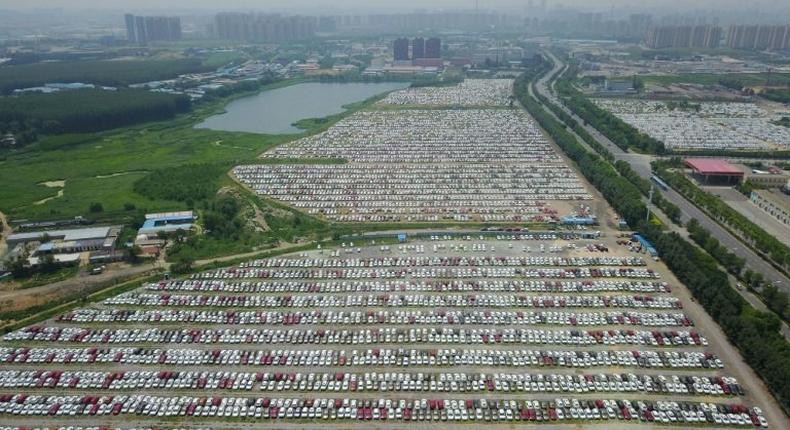 New cars are seen in a parking lot of the Brilliance factory in Shenyang, in China's northeast Liaoning province on July 17, 2017