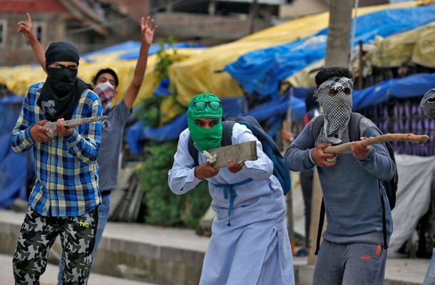 The Wider Image: Kashmir's stone-pelters face off against pellet guns