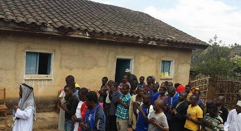 Rwandan pastor and his congregation performing Salat