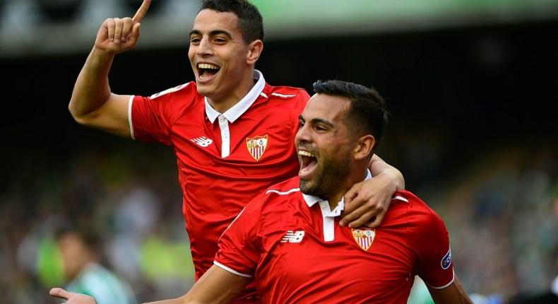 Sevilla's defender Gabriel Mercado (R) celebrates after scoring a goal with forward Wissam Ben Yedder (L) during the Spanish league football match against Real Betis February 25, 2017