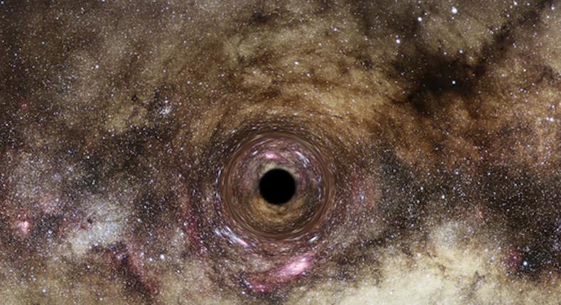 An artist's impression of a black hole. Scientists think they discovered one of the biggest recorded black holes, which is so massive that it distorts the light from galaxies behind it.ESA/Hubble, Digitized Sky Survey, Nick Risinger (skysurvey.org), N. Bartmann