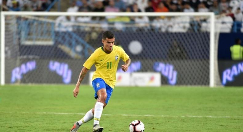 Brazil midfielder Philippe Coutinho, playing here against Saudi Arabia last month, is one of three players to drop out of Tite's squad through injury