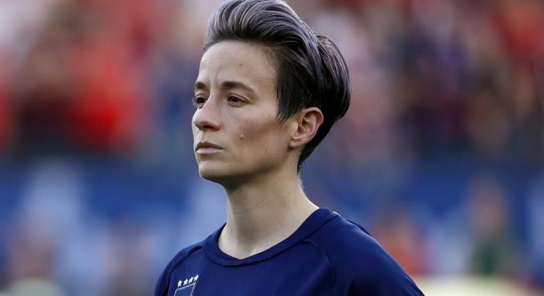 US star Megan Rapinoe wears her jersey inside-out to hide the US Soccer Federation logo during the national anthem before a SheBelieves Cup match against Japan in Frisco, Texas