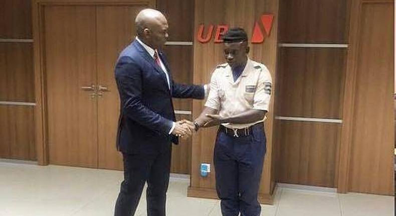 Tony Elumelu and security guard