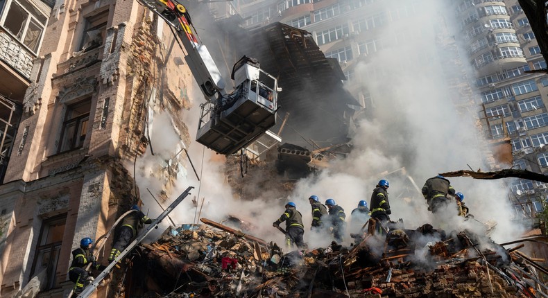 Firefighters work after a drone attack on buildings in Kyiv, Ukraine, Oct. 17, 2022.AP Photo/Roman Hrytsyna, File