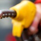 FILE PHOTO: An attendant prepares to refuel a car at a petrol station in Rome