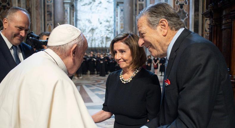 Pope Francis greets Speaker Nancy Pelosi and her husband, Paul, on Wednesday before a mass at the Vatican.