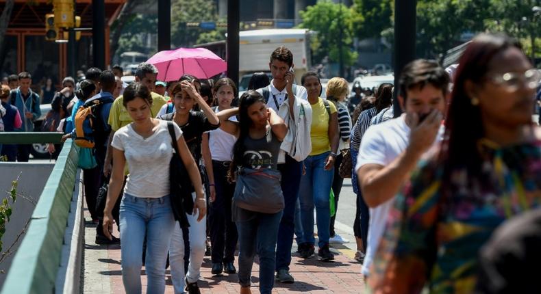 Commuters unable to use the subway due to a partial power cut, flock to the streets in Caracas