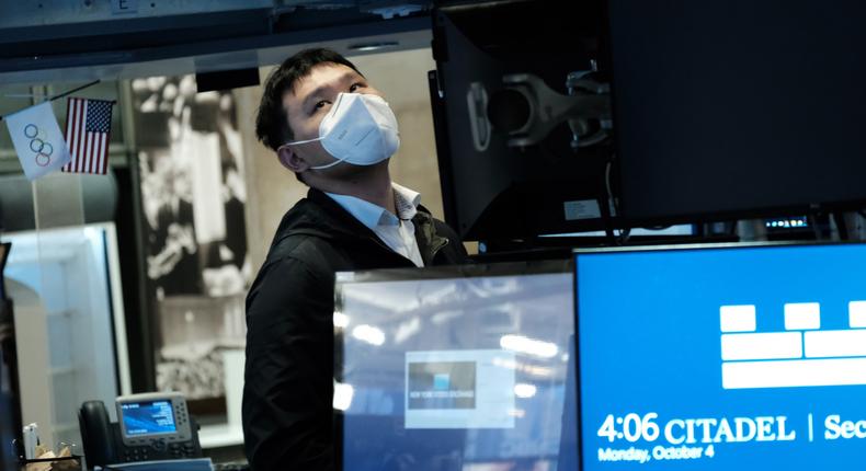 A trader works on the floor of the New York Stock Exchange.
