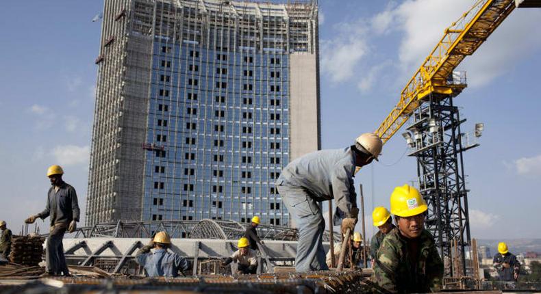 Chinese construction workers build the new African Union building in Addis Ababa, Ethiopia.