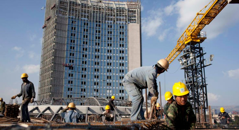 Chinese construction workers build the new African Union building in Addis Ababa, Ethiopia.