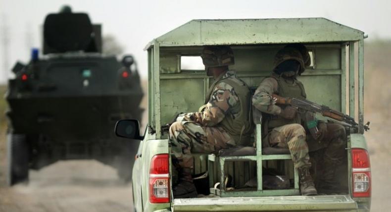 Nigerian soldiers patrol on June 5, 2013 near Maiduguri