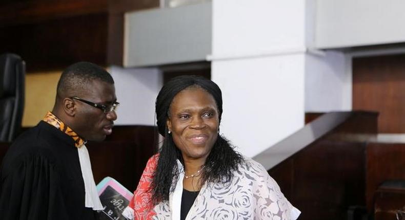 Ivory Coast's former first lady Simone Gbagbo (R), who is accused of crimes against humanity and war crimes for her alleged role in a 2011 civil war, arrives in a domestic court in Abidjan, Ivory Coast, May 31, 2016. 