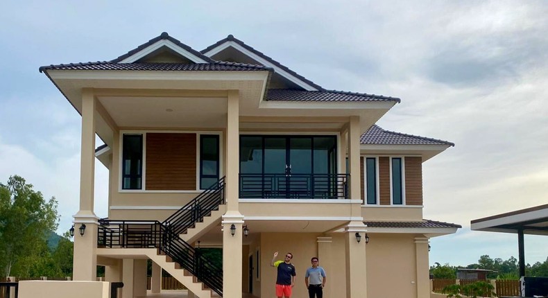 Ben and the builder standing in front of the house. The photo was taken on the day Ben and his wife collected the keys to their home.Ben/Life in Thailand