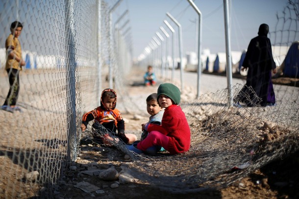 Displaced Iraqi children, who fled the Islamic State stronghold of Mosul with their families, play a