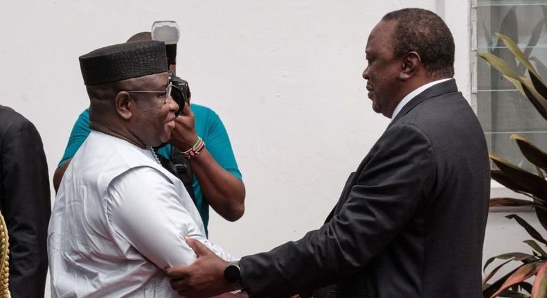 Kenya's President Uhuru Kenyatta (R) receives Sierra Leone's President Julius Maada Bio at the State House in Nairobi, Kenya, on May 30, 2022. (Photo by YASUYOSHI CHIBA/AFP via Getty Images)