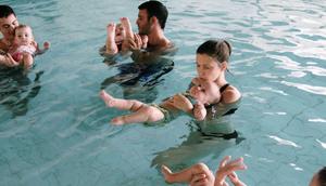 Toddlers explore the water with their mothers during a swimming class for babies at Lane Cove pool February 16, 2007 in Sydney, Australia.Getty Images/Ian Waldie