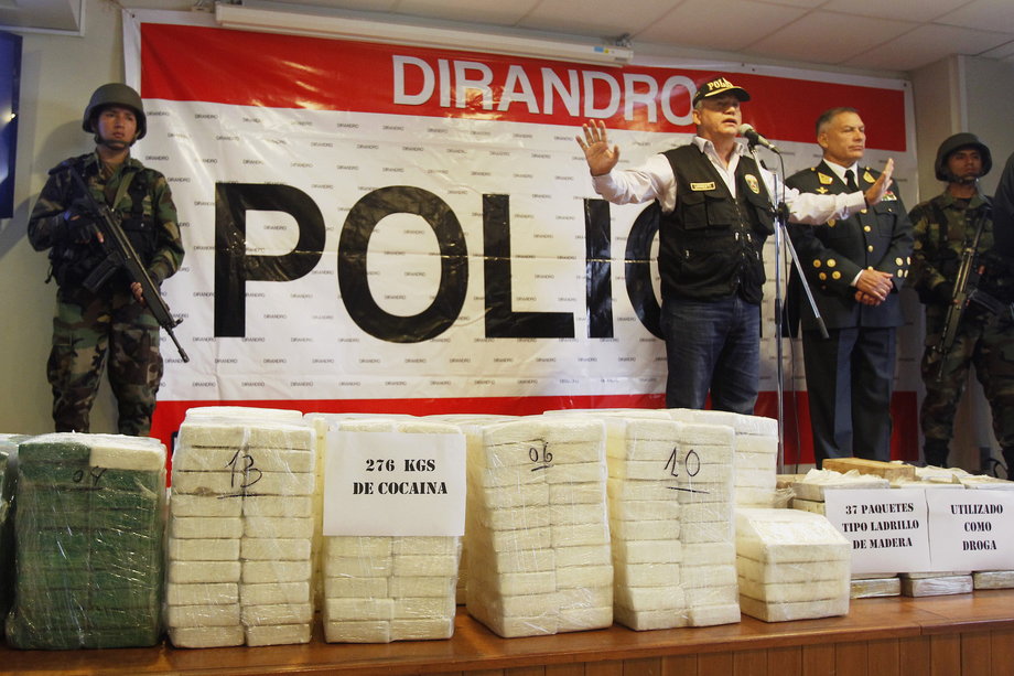 Peru's Interior Minister Daniel Urresti speaks to media next to seized cocaine bricks at a police headquarters in Lima, November 4, 2014.