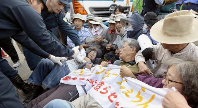Japanese protesters dragged away as work resumes at U.S. airbase