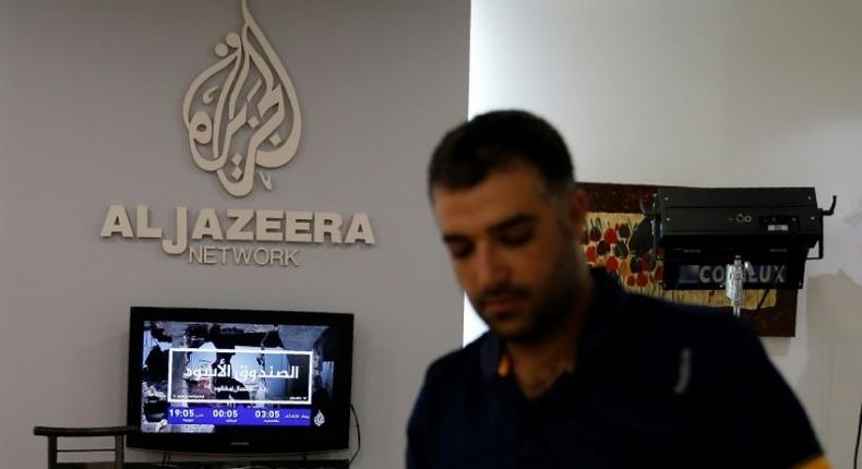 An employee of Qatar-based Al-Jazeera at the broadcaster's Jerusalem office on July 31, 2017