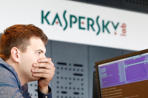 FILE PHOTO: An employee works near screens in the virus lab at the headquarters of Russian cyber security company Kaspersky Labs in Moscow