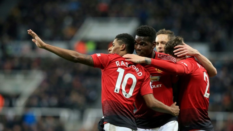 Manchester United players celebrate Marcus Rashford's goal against Newcastle