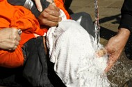 File photo of demonstrators simulating waterboarding at the Justice Department in Washington