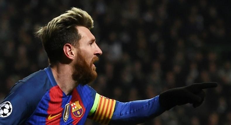 Barcelona's Argentinian striker Lionel Messi celebrates scoring the opening goal against Celtic in Glasgow on November 23, 2016