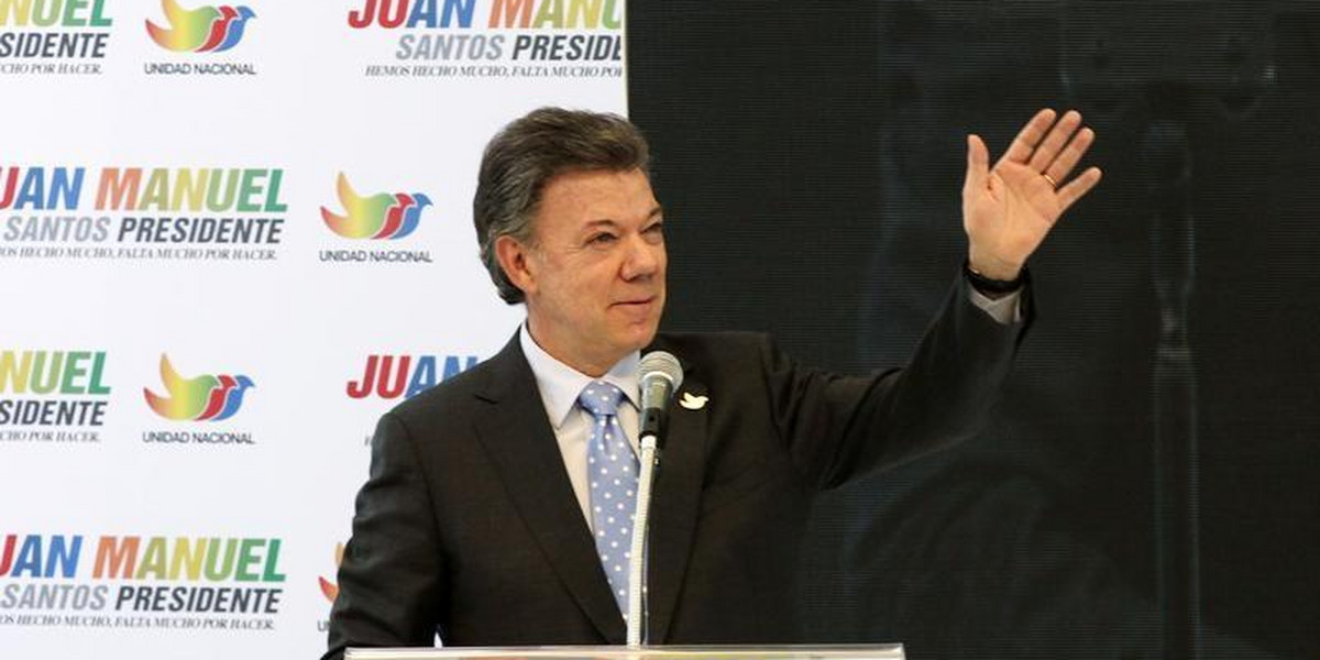 Colombia's President Juan Manuel Santos greets supporters during a campaign rally in Bogota