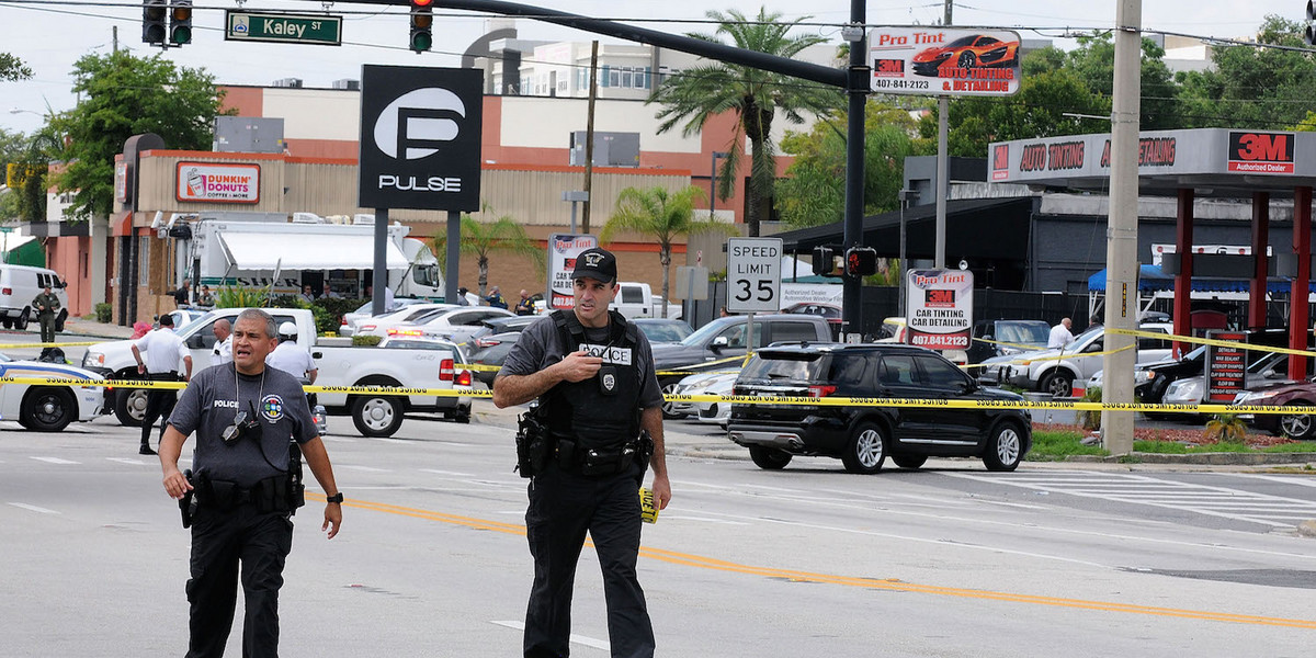 Orlando police officers seen outside of Pulse nightclub after a fatal shooting and hostage situation where 50 people died on June 12, 2016 in Orlando, Florida.