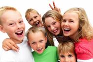 Group of excited young children laughing 