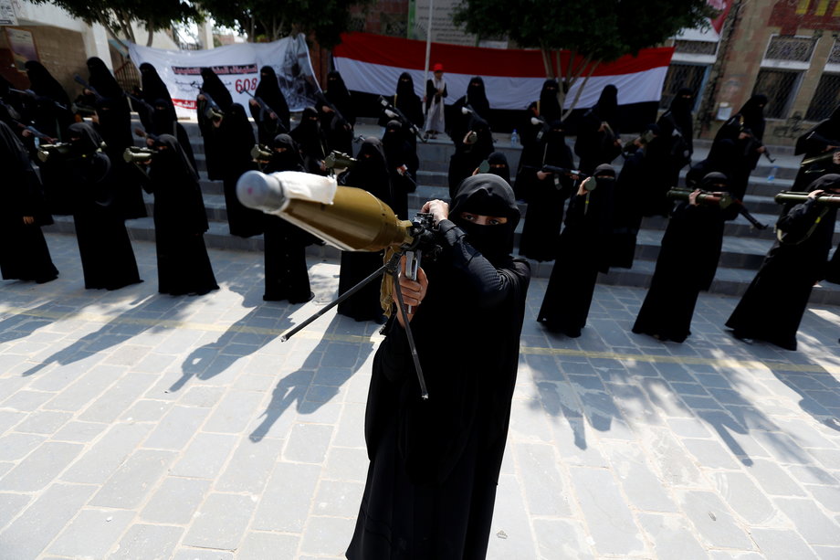 A woman loyal to the Houthi movement holds a rocket-propelled grenade as she takes part in a parade to show support for the movement in Sanaa, Yemen, September 6, 2016.
