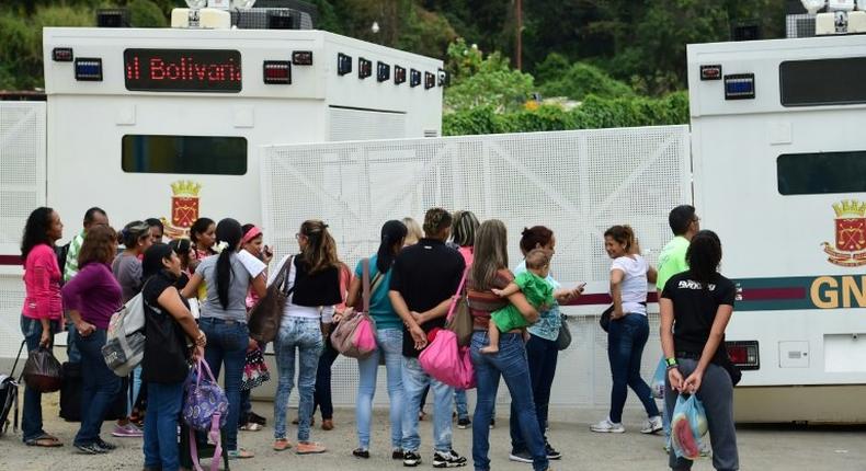 Protesters outside a prison east of Caracas where opposition leader Leopoldo Lopez in being held