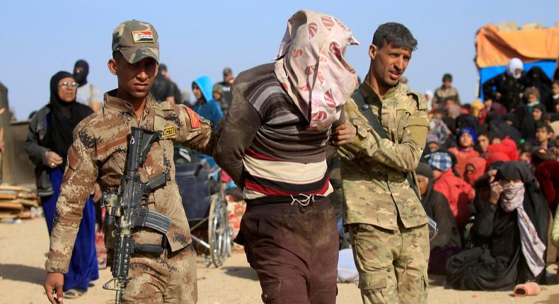 Iraqi special operations forces arresting a person suspected of belonging to ISIS in western Mosul, Iraq, on February 26.