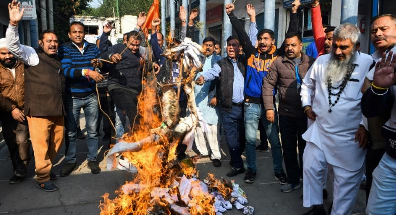 Activists protest against the rape and murder of a 27-year-old woman in India. Police later shod dead the four detained suspects as they re-enacted the crime